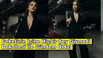 Ceketinin altına hiçbir şey giymedi, dekoltesi dikkat çekti