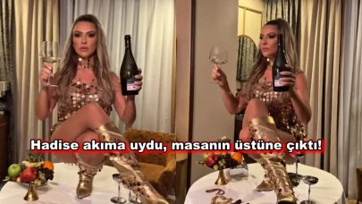 Hadise yine rahat durmadı! Bacak bacak üstüne atıp masaya çıktı!